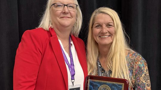 Foster earns statewide service award, elected TACA president