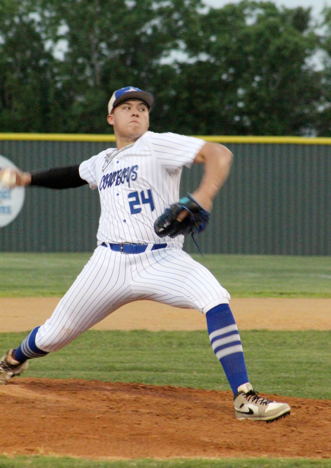 Edna pitcher Jaykub Reyes fires a pitch against Columbus High School.